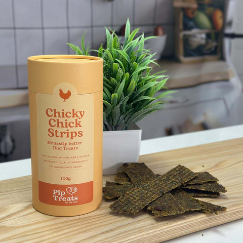 Chicky Chick Strips canister and air-dried chicken treats in a kitchen — Pip Eats